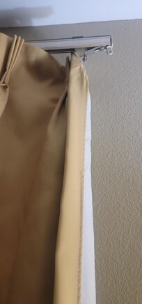The curtains in every room seem to be broken like this