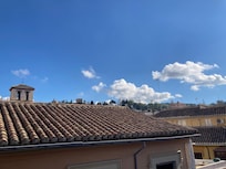 Room on third floor with the view towards the front of the hotel, you can see Alhambra castle, barely but you can see it
