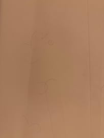 Multiple hairs on the floor of the shower.