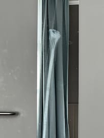 What appeared to be either lipstick or spit smeared down the door mirror.