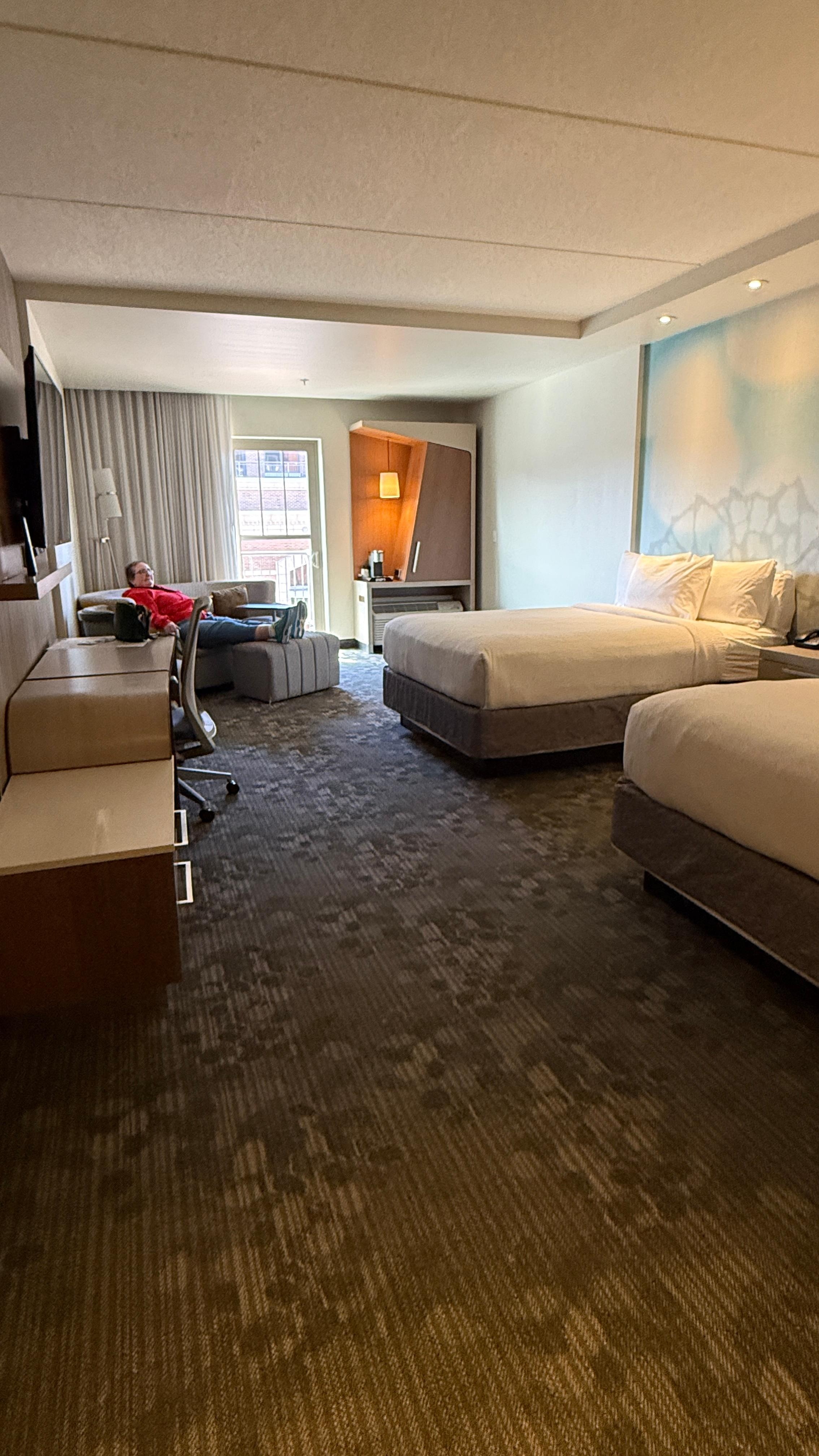 Spacious bedroom with two queens and attractive sleeper sofa