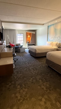 Spacious bedroom with two queens and attractive sleeper sofa