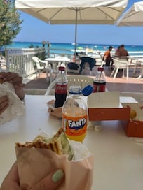 View of beach from pool seating area