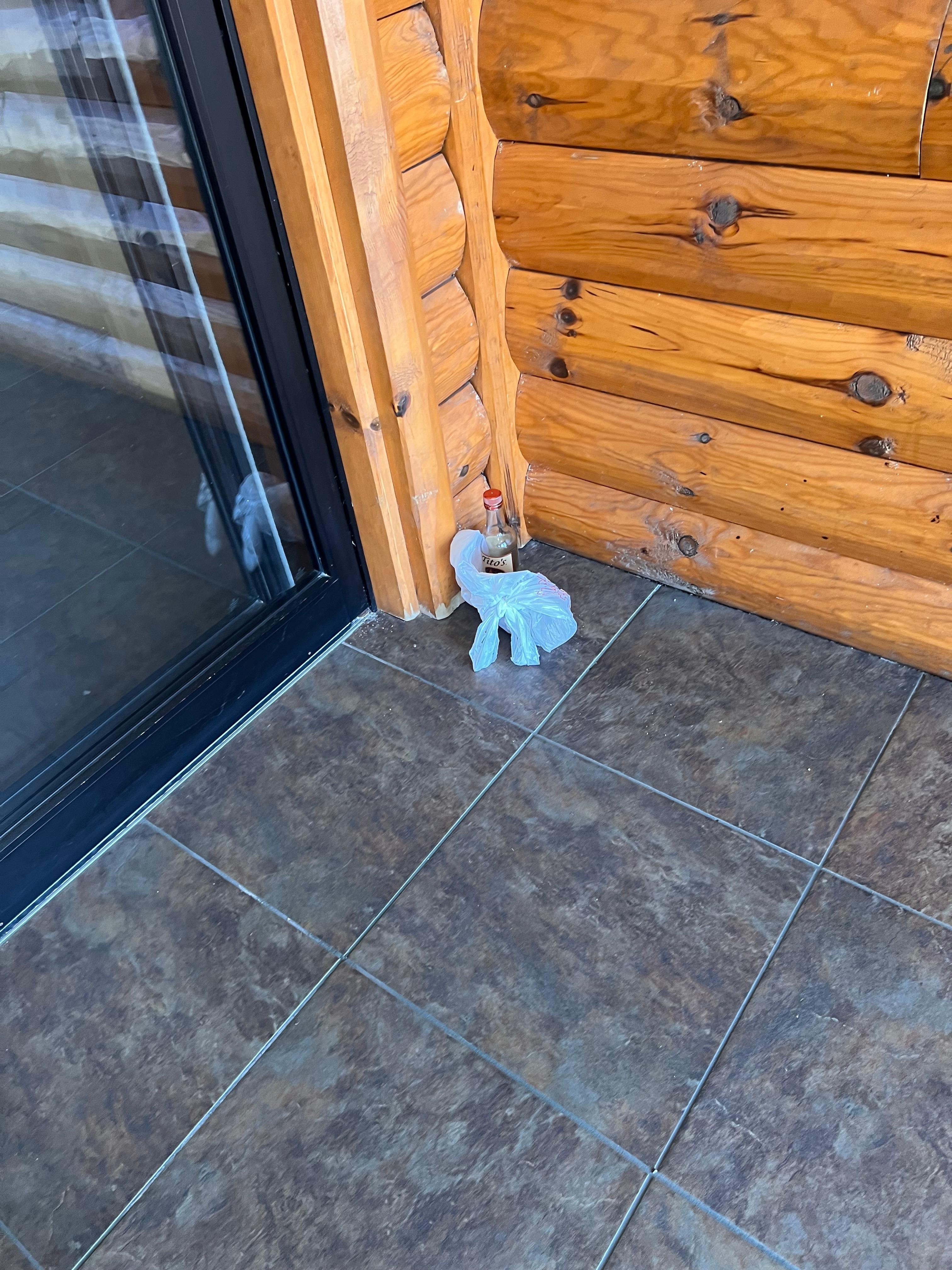 Trash in entryway to building