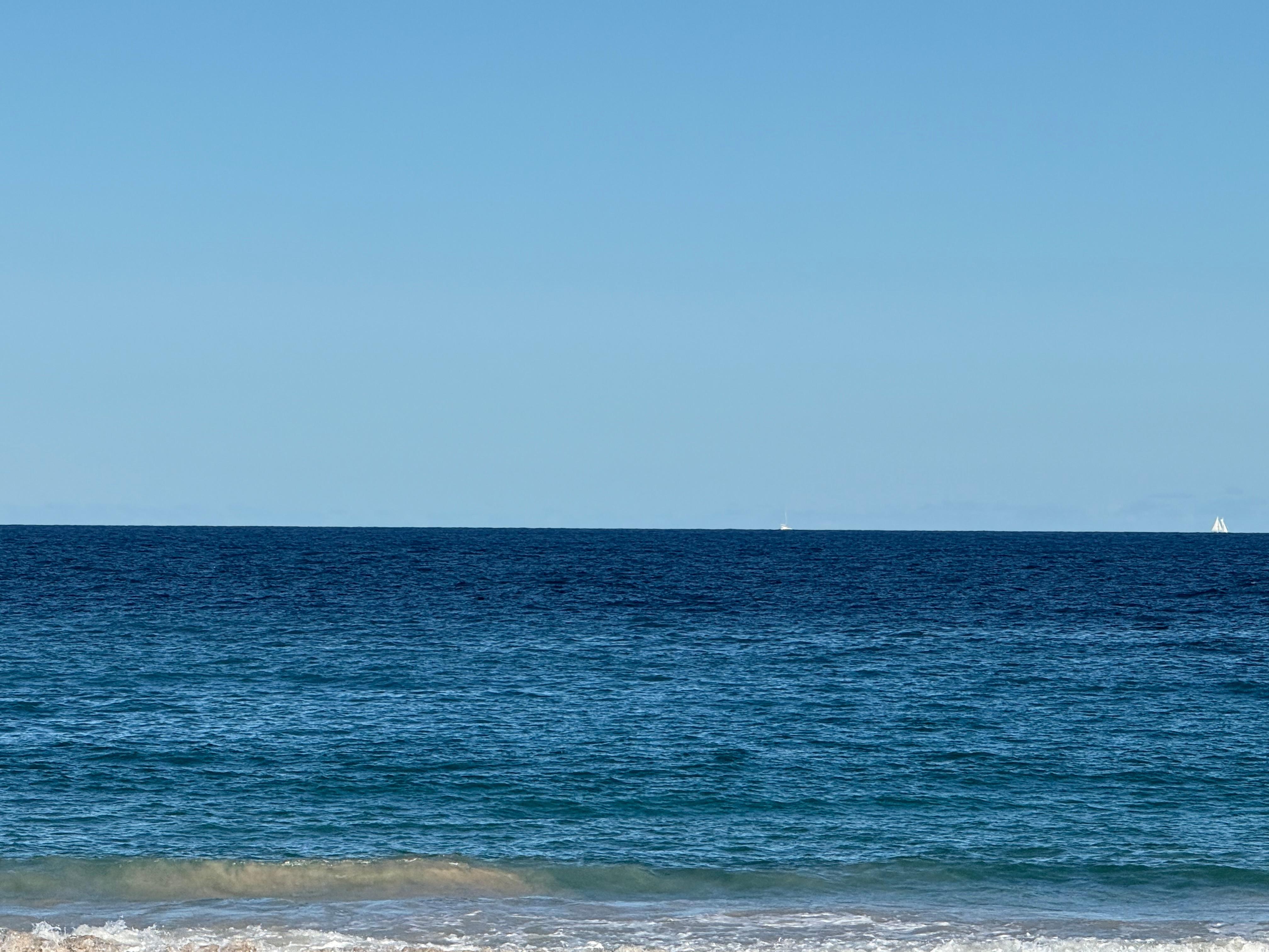 The crystal clear cerulean water steps from the pool and lanai
