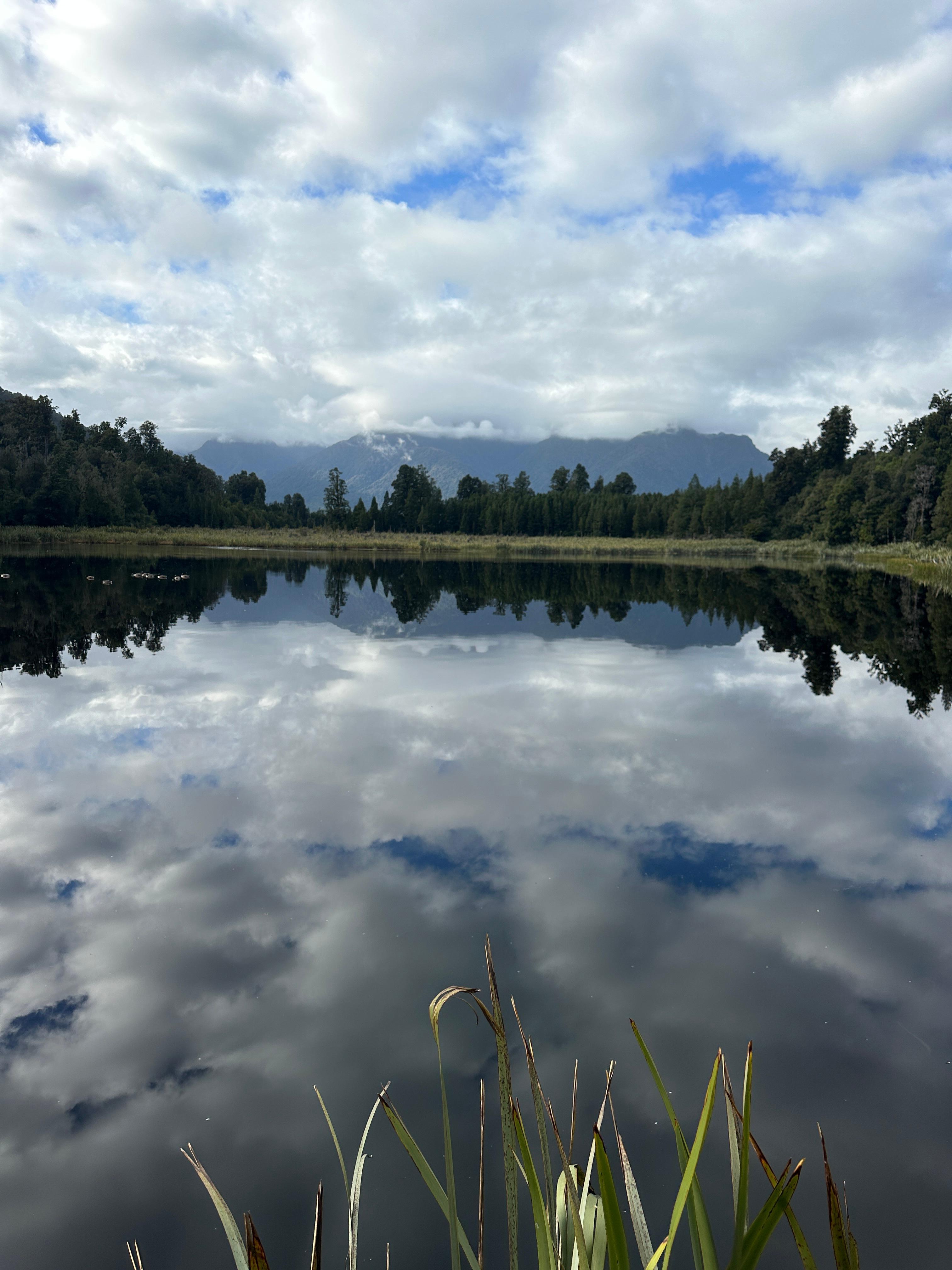 Lake Matheson reflects the surrounding contryside