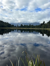 Lake Matheson reflects the surrounding contryside
