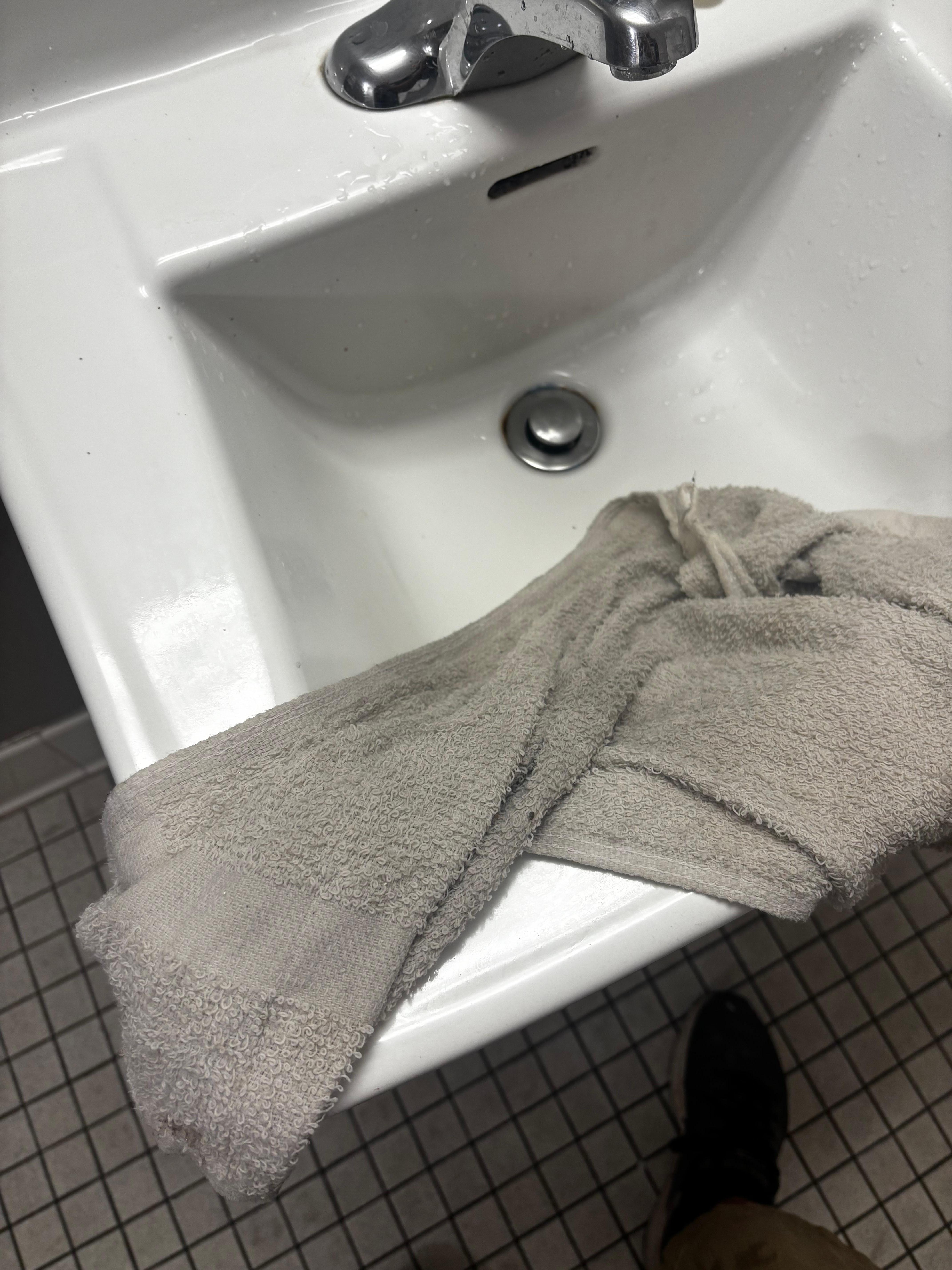 White towel rinsed after used to clean floors first time