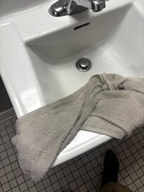 White towel rinsed after used to clean floors first time