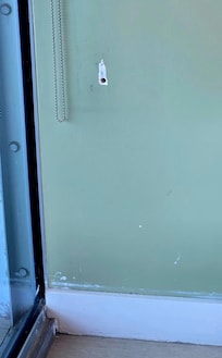 Several areas had unfixed holes, and notice the paint all over the trim area