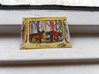 Mini painting of picture window with deer outside.