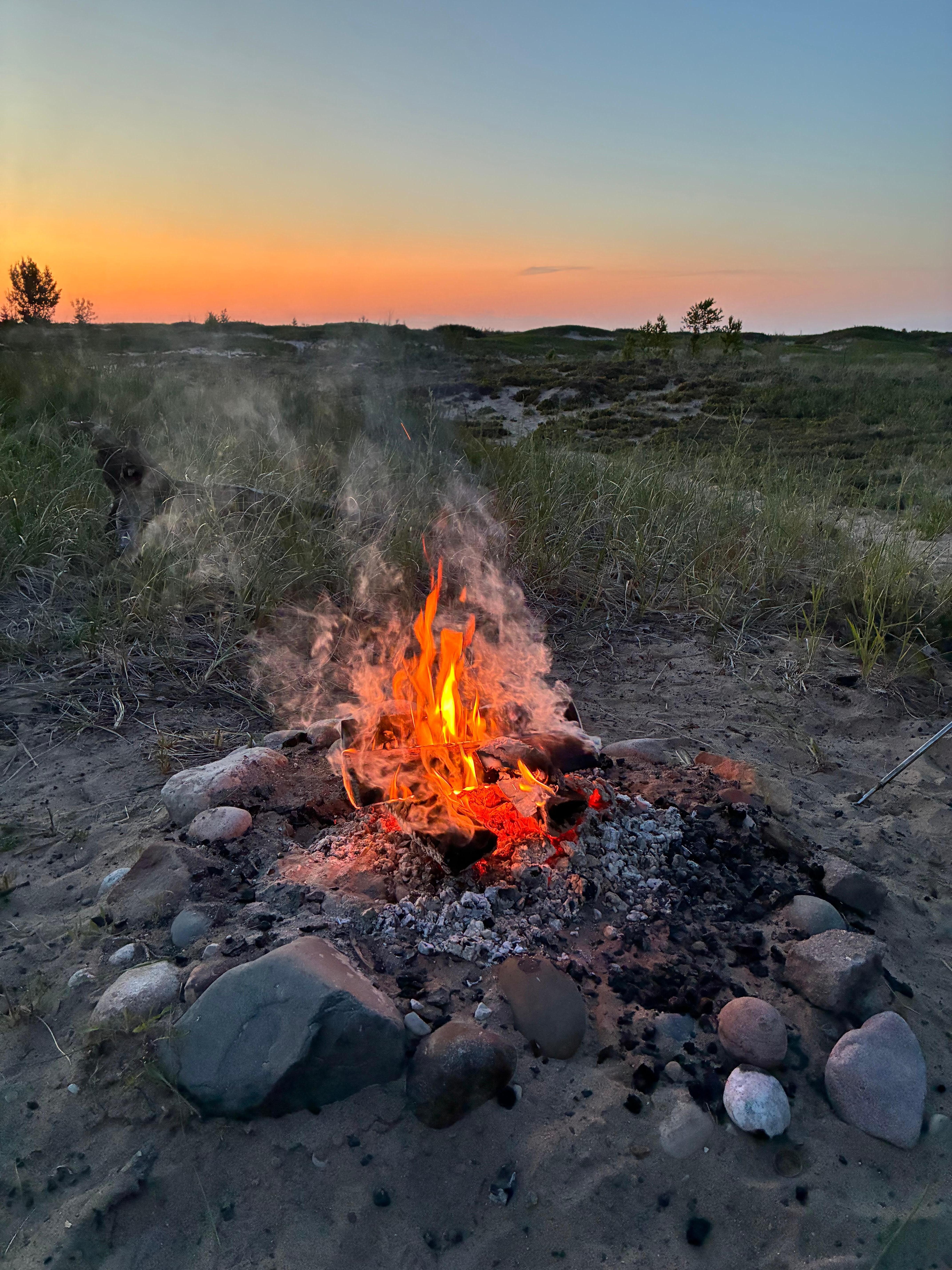 Backyard campfire at sunset