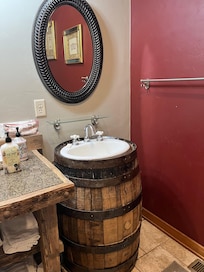 One of the twin barrel sinks in an upstairs bathroom.