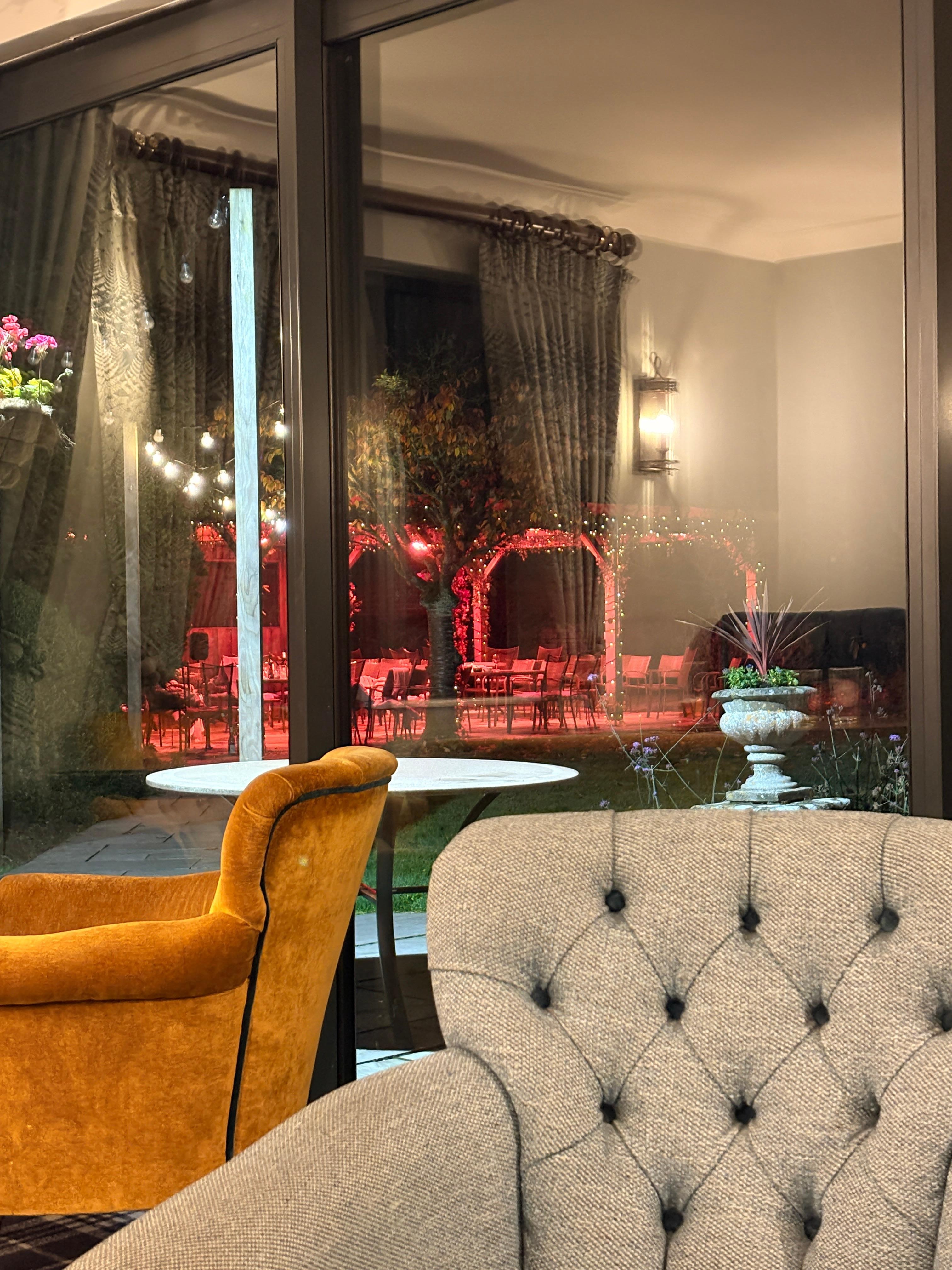 An evening wedding event all lit up outside. 