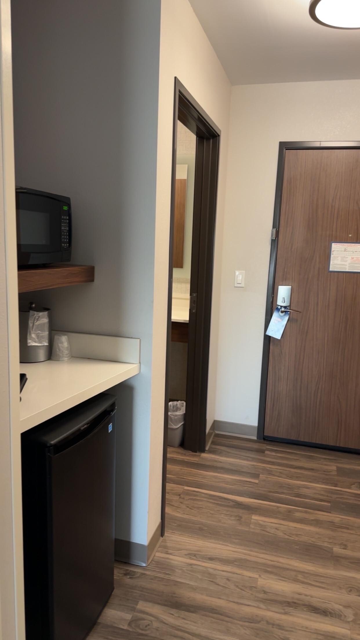 Small fridge and coffee pot and microwave 