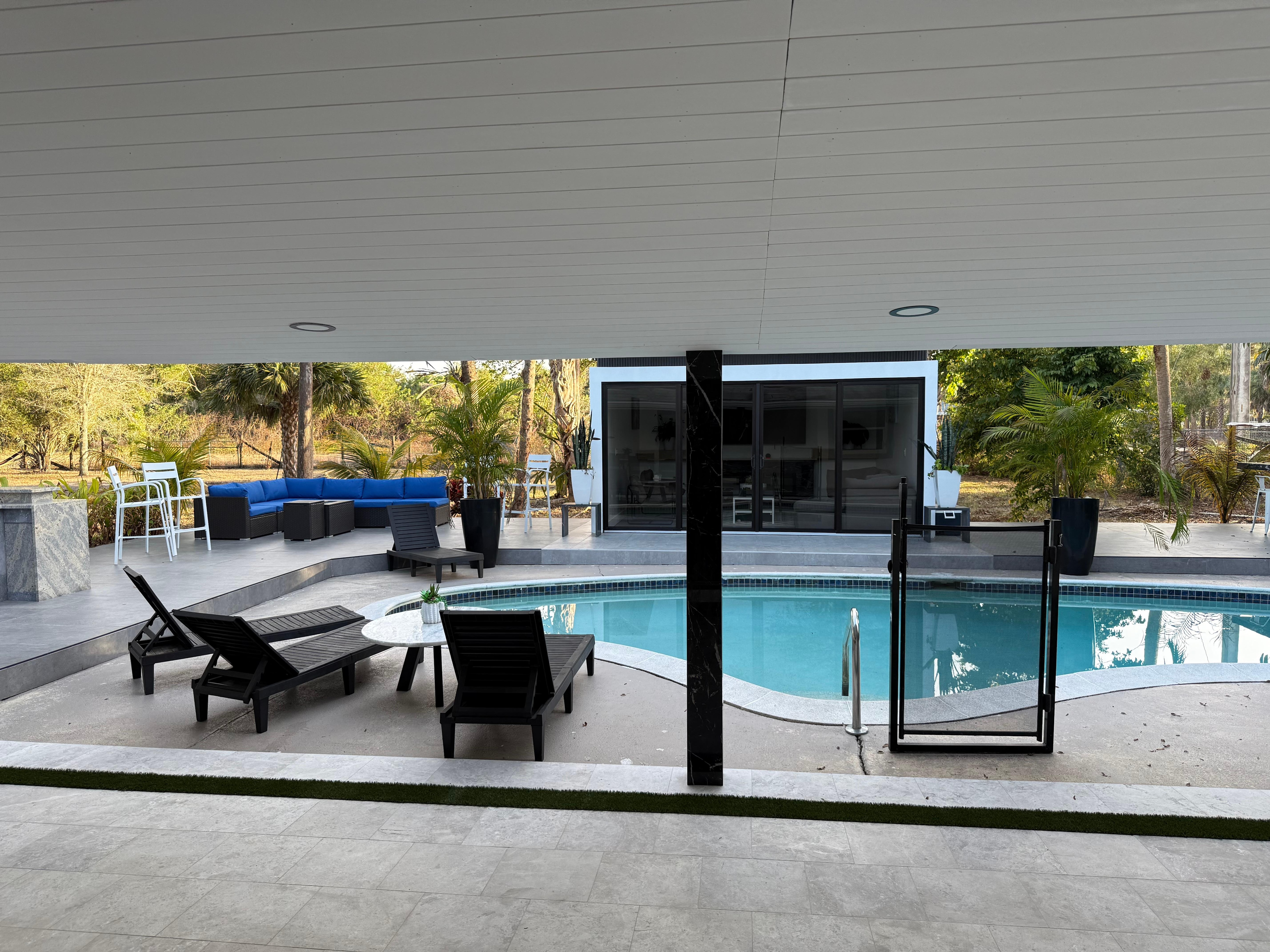 Some might call this a pool house, but that’s an understatement. It’s more like an additional luxury living room adjacent to the house. You can easily host more than one family in this home and still have lots of privacy. 
