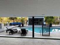 Some might call this a pool house, but that’s an understatement. It’s more like an additional luxury living room adjacent to the house. You can easily host more than one family in this home and still have lots of privacy.