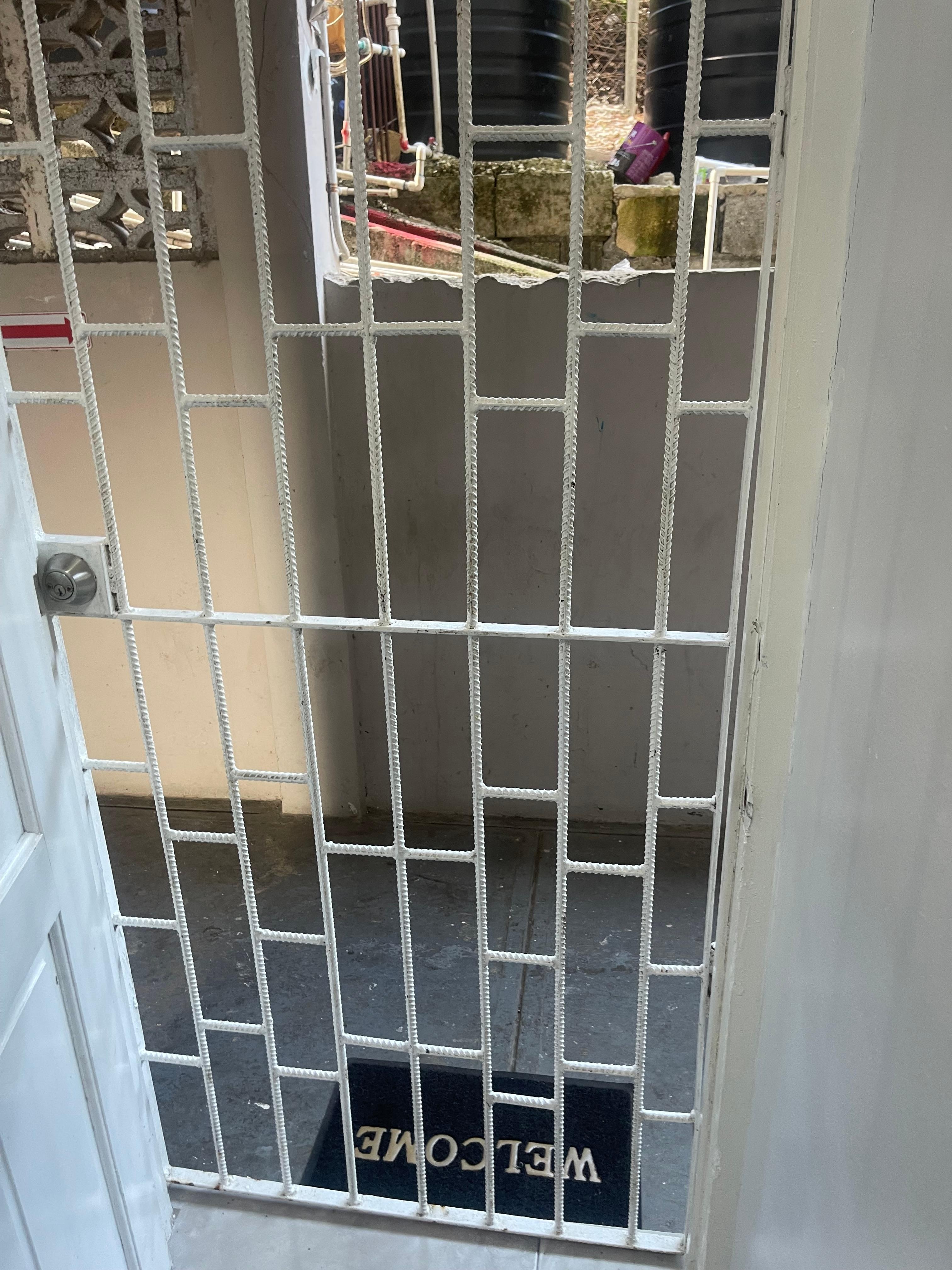 The grill that covers the door to the unit 210