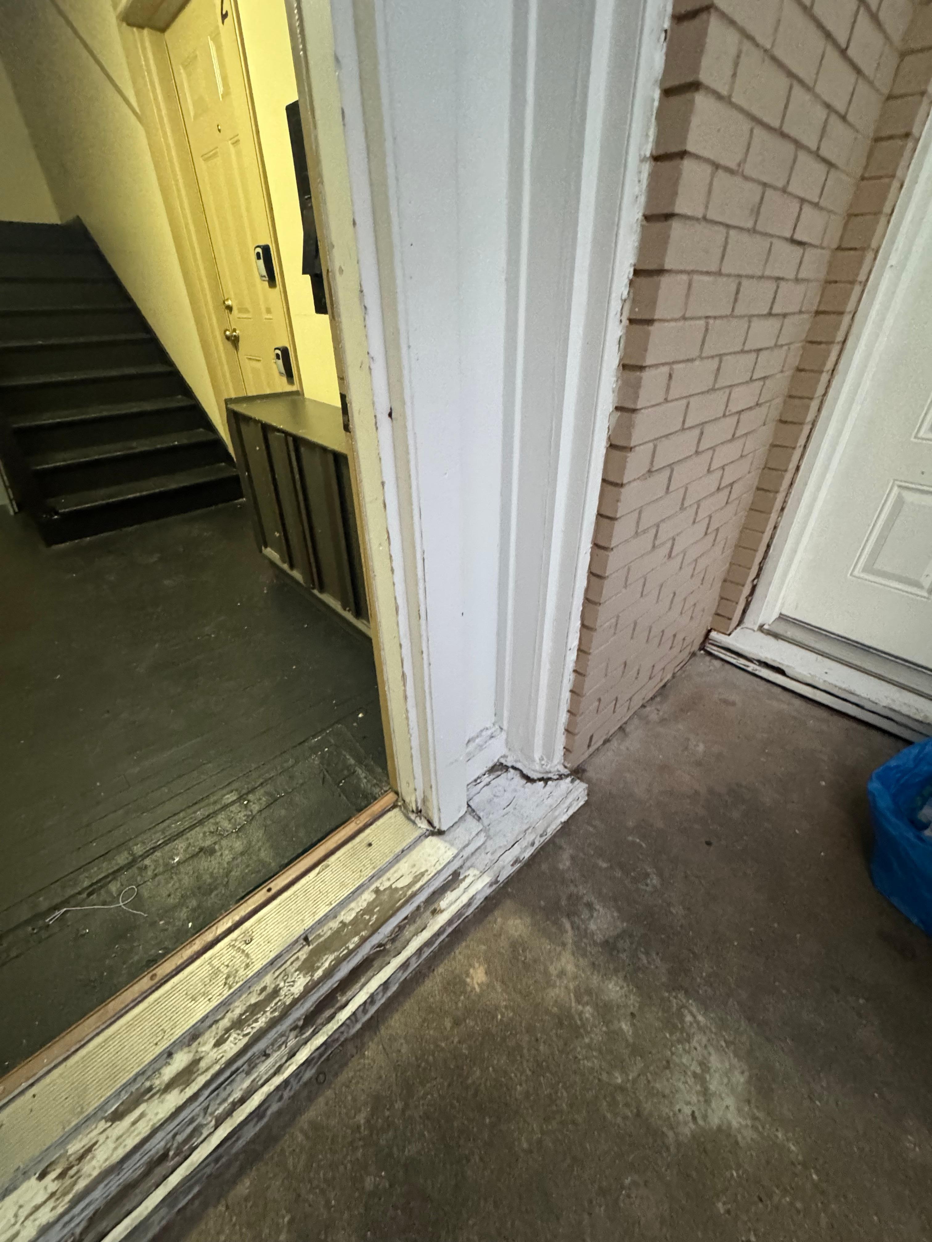 Front door threshold; representative condition of building