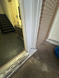 Front door threshold; representative condition of building
