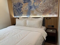 Clean bed welcoming us.