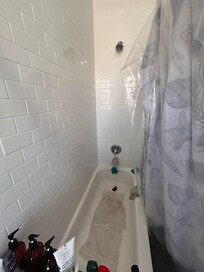 Bathroom tub was extremely slippery with no grips or anything. I had to put hand towels to prevent from falling. There was no hand grip of any kind