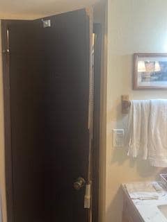 Wood coming off door in bathroom