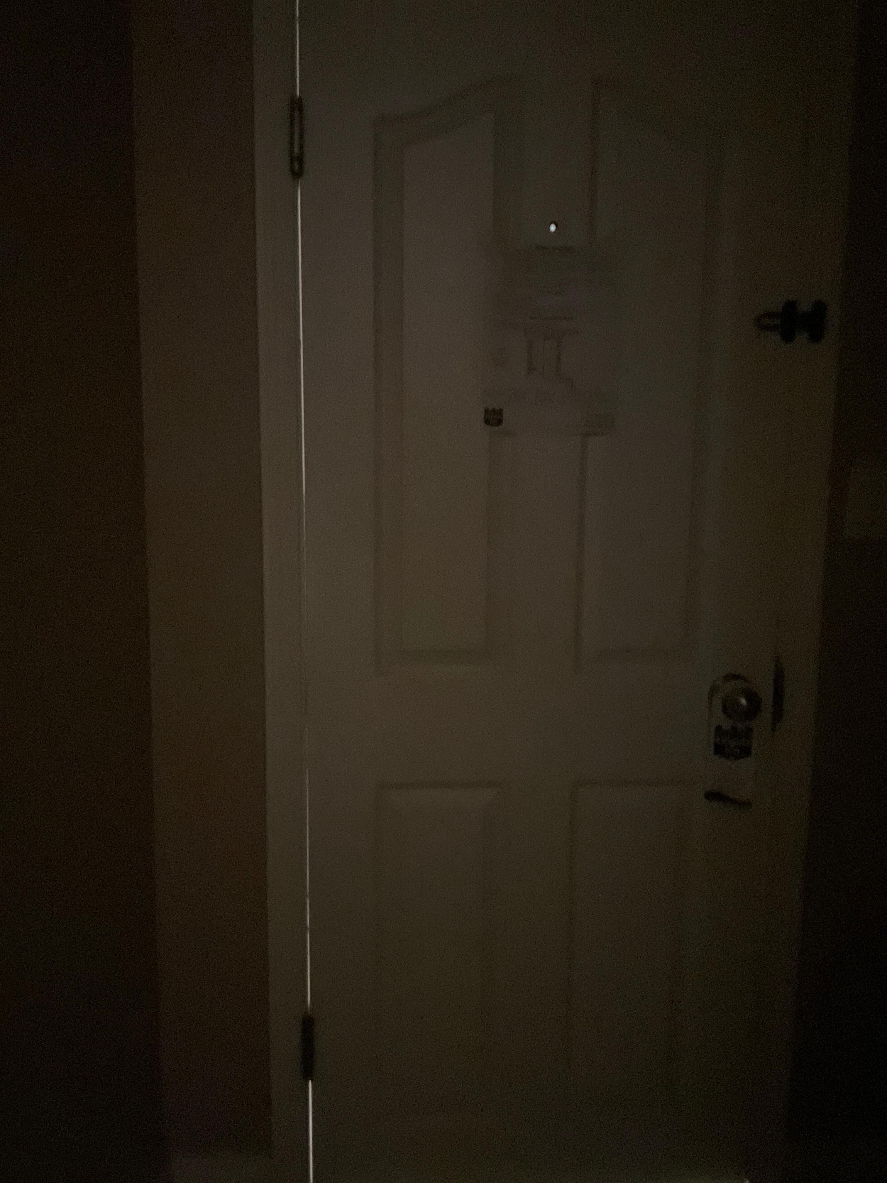 Crack around door so you can see hallway