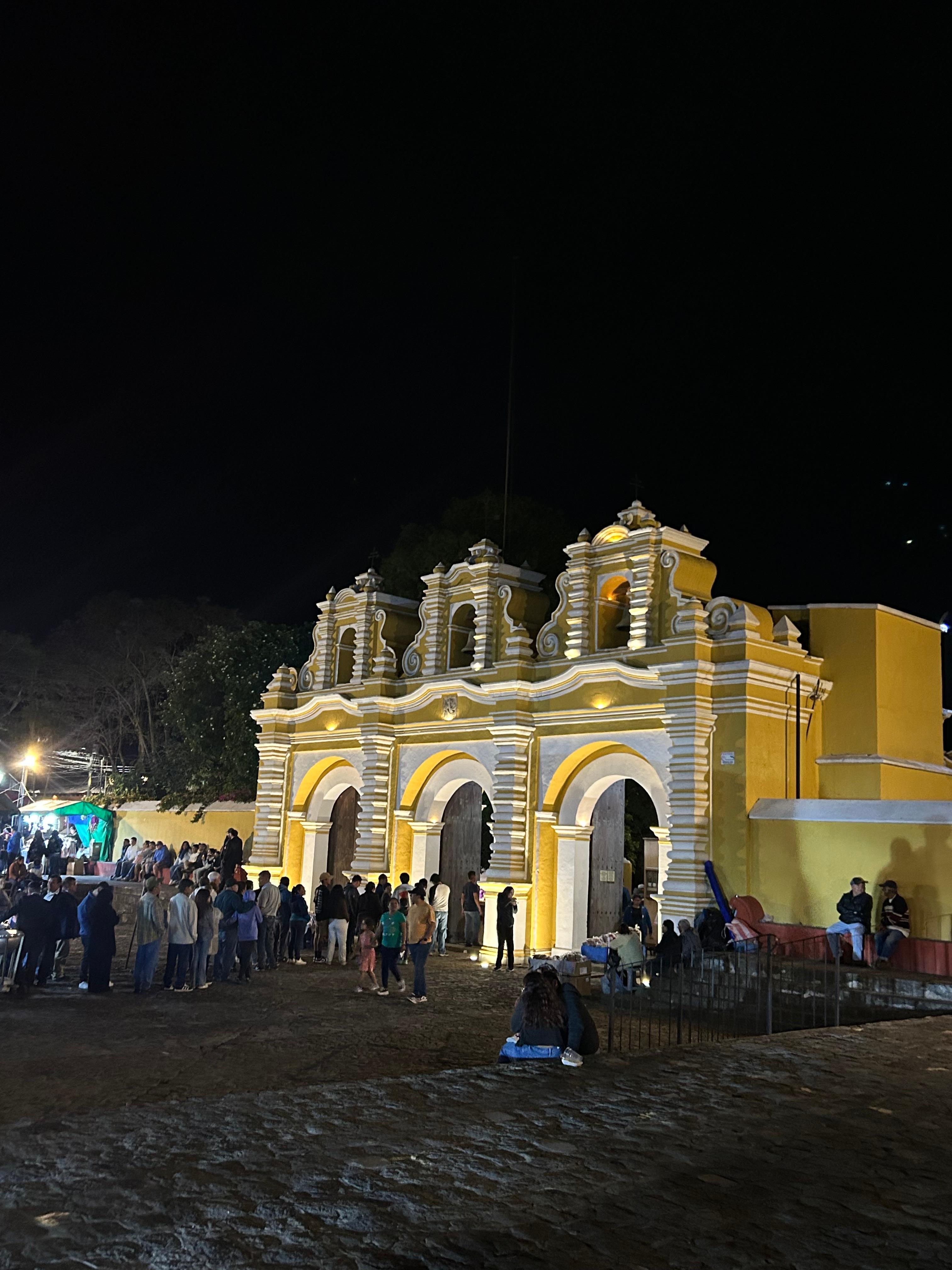 Across the street next to a small Mercado. 