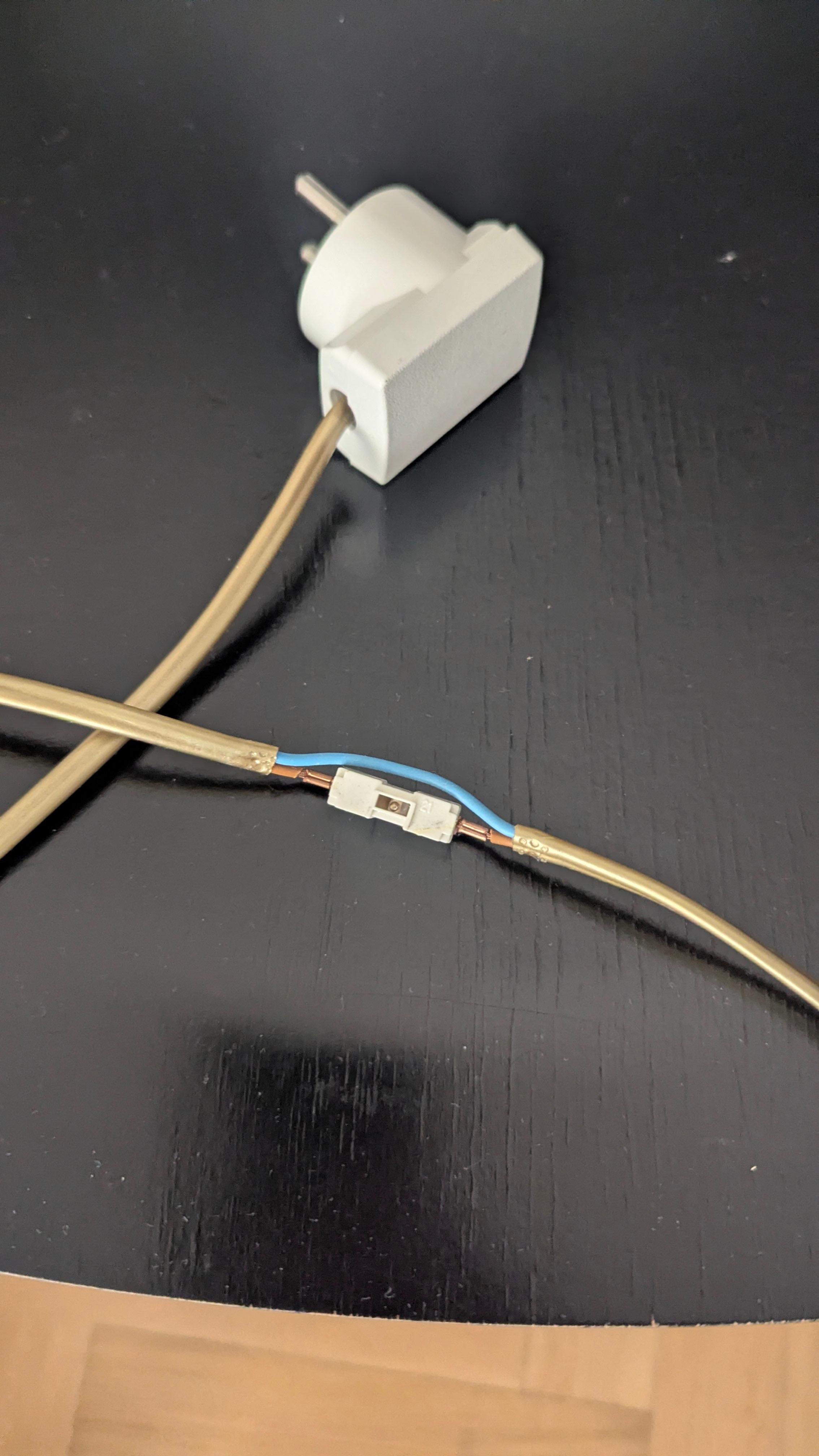 The exposed wiring on the lamp which caused an electric shock!