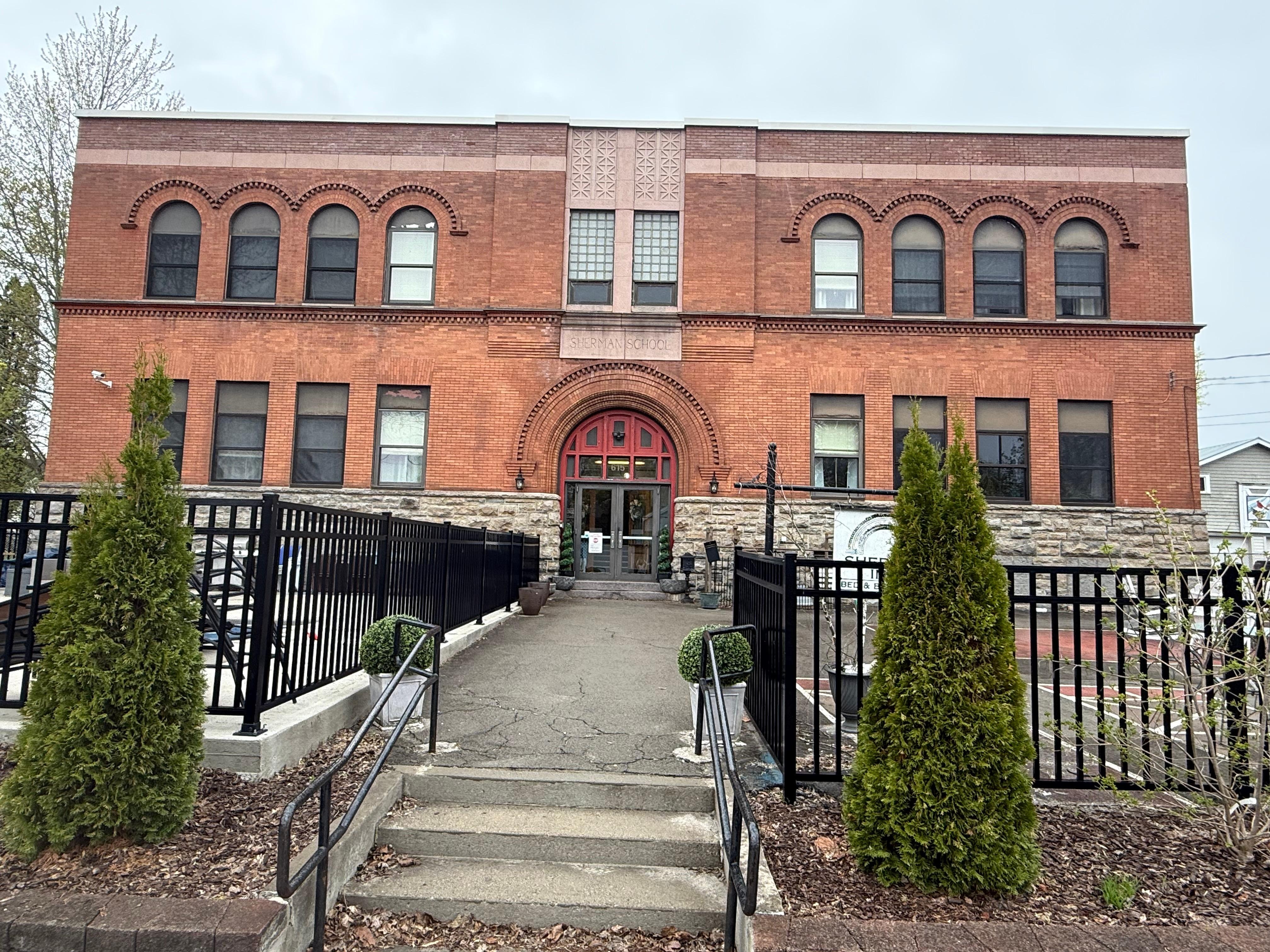 Exterior view - note Sherman School sign