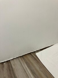 Bathroom door warped from moisture.