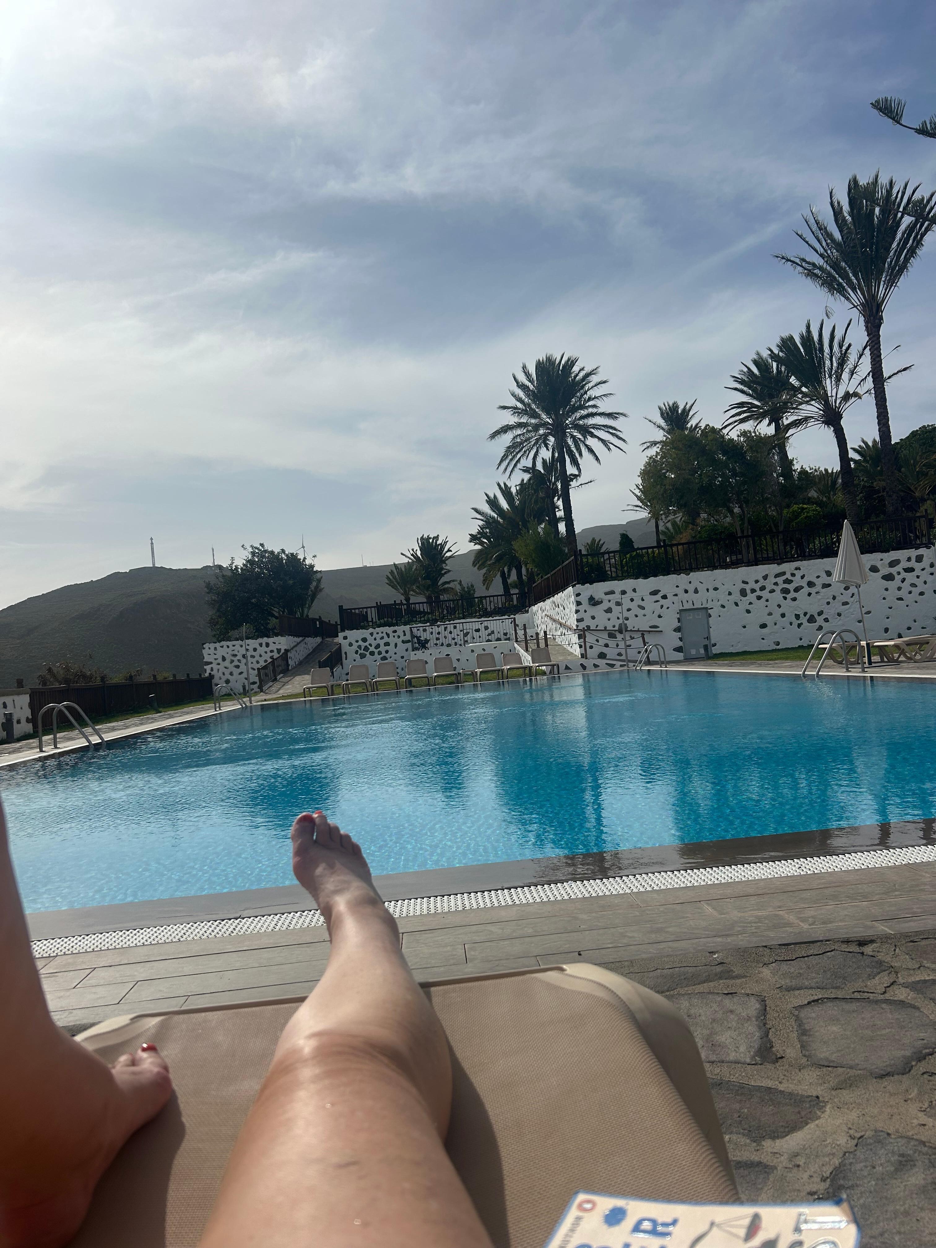 Relaxing by the pool after driving round the island 