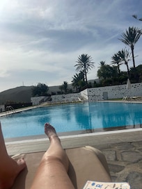 Relaxing by the pool after driving round the island