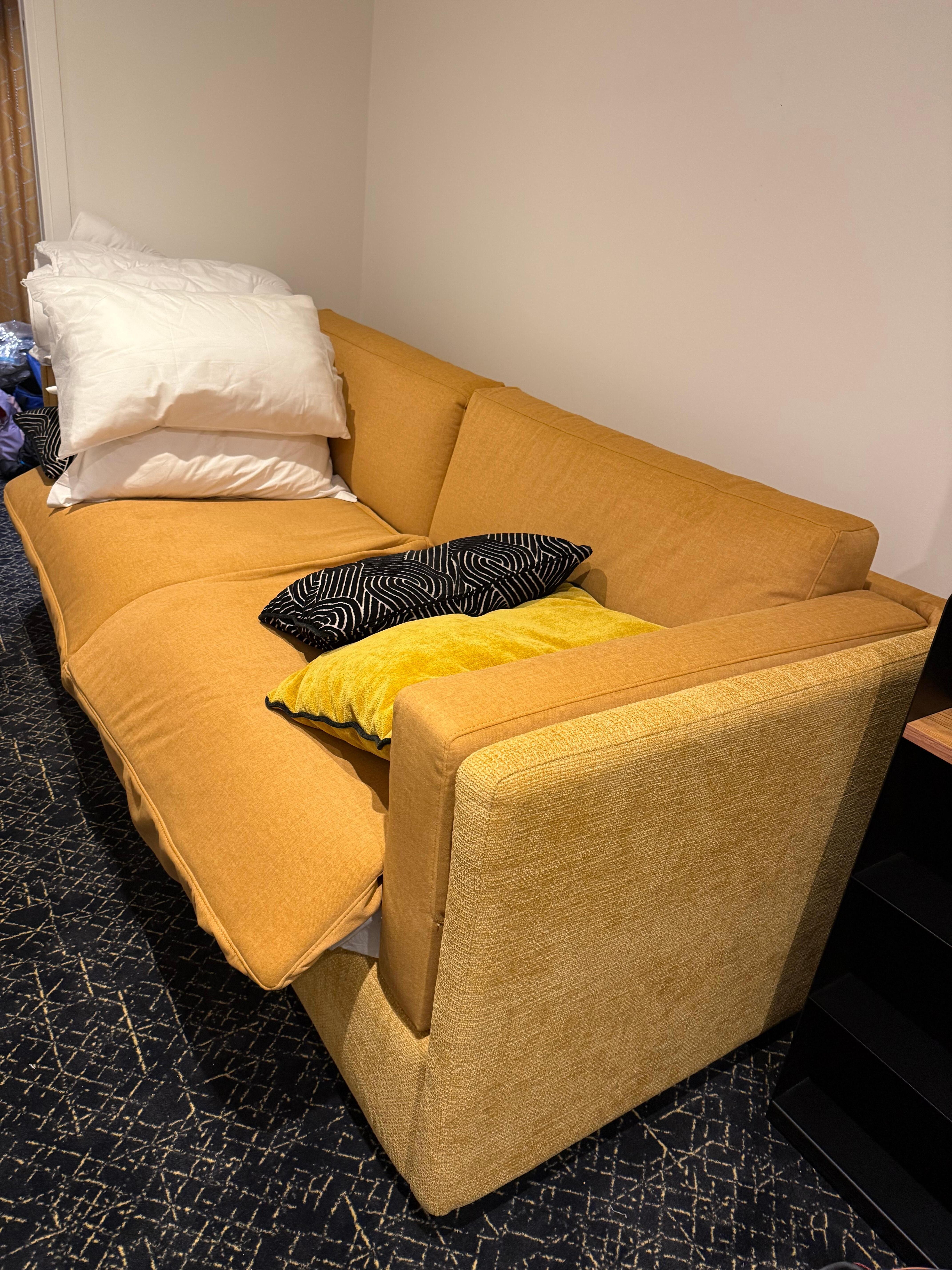 Sofa that converts into a double deck.  Can be comfortable to sleep on with the proper cool temp inside the room.   