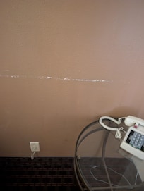 Scratches on wall. Paint peeling.