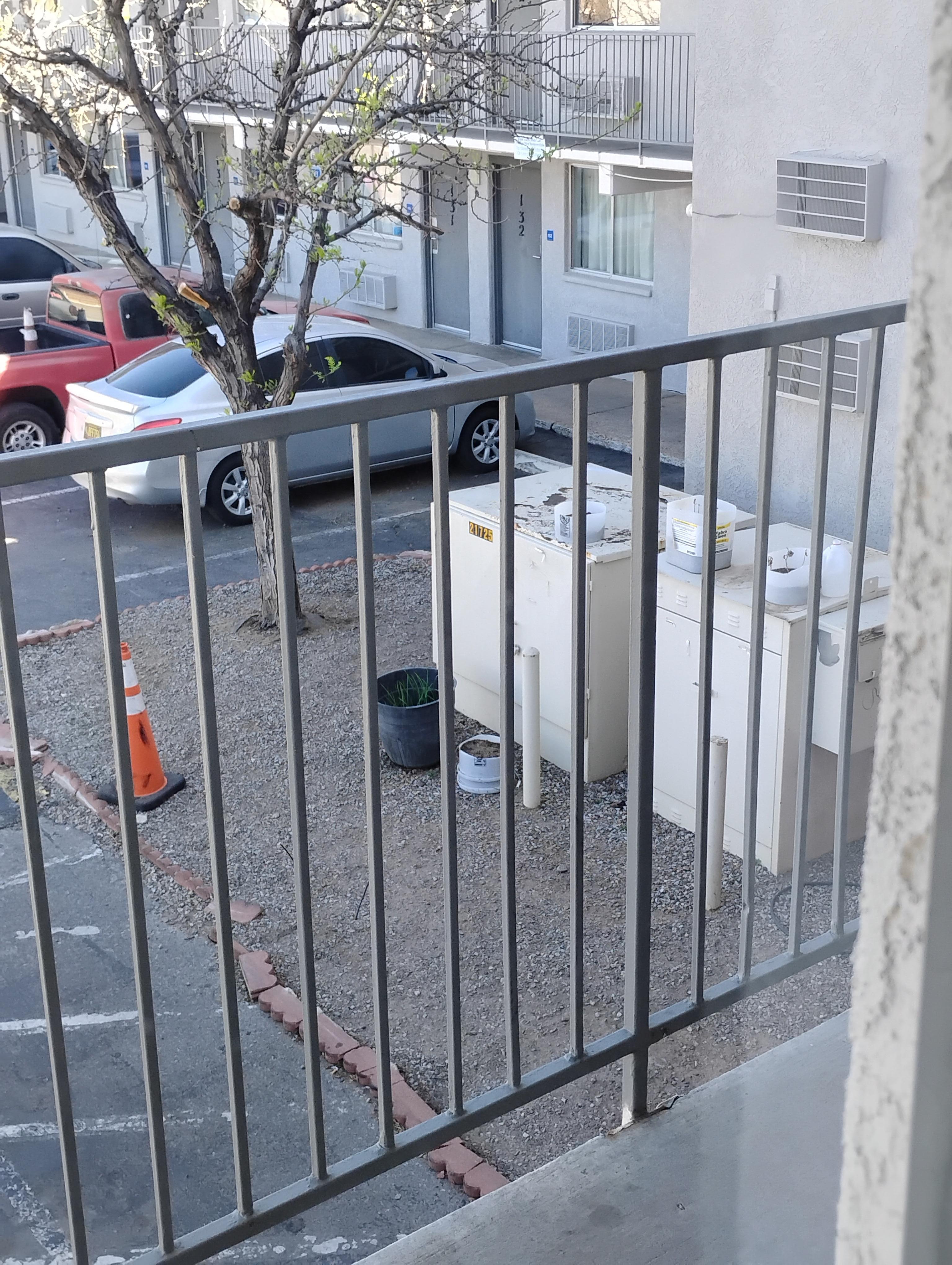 Trash in front of the ACC unit. 