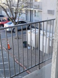 Trash in front of the ACC unit.