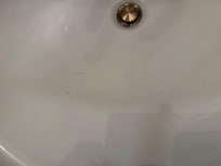 Hair & tooth paste dried and hardened in sink.