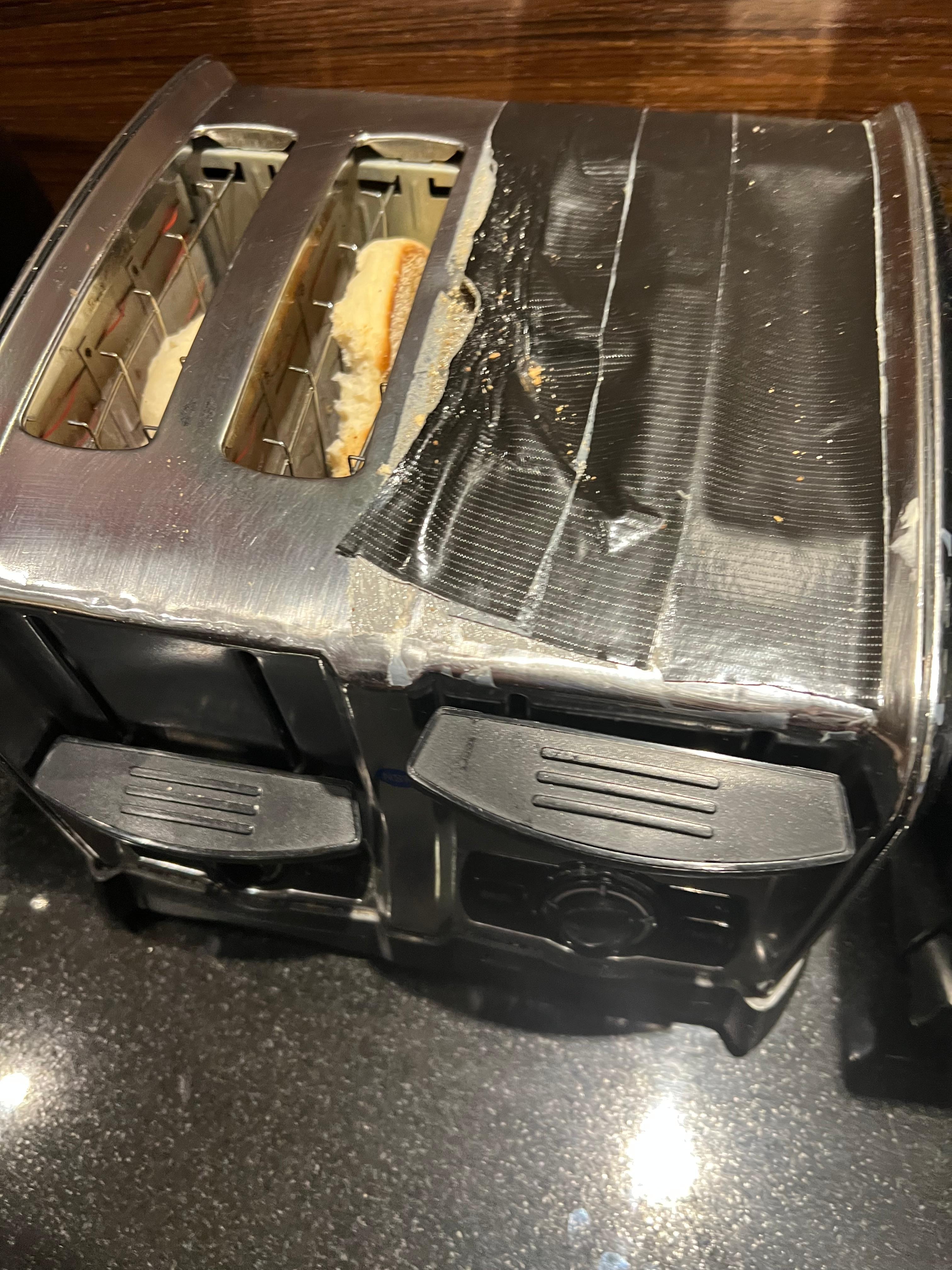 Toaster “repaired” with duct tape