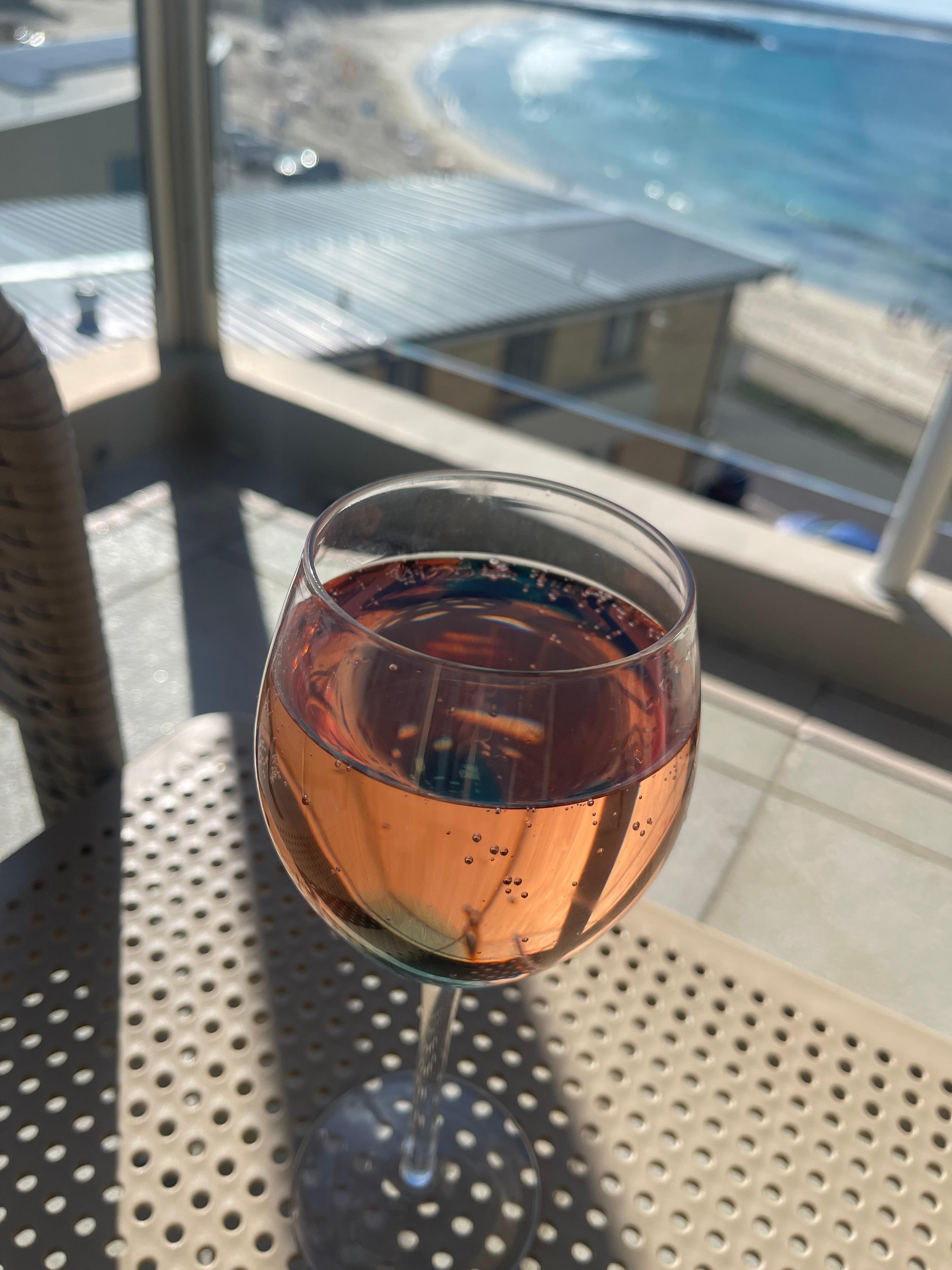 Glass of wine table setting from balcony.