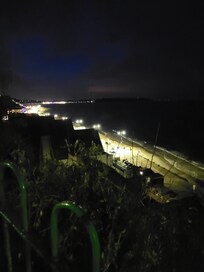 View at night from just down from the hotel, where there's green space to take your dog out to the toilet.