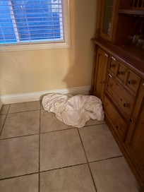 Dirty sheets left on kitchen floor