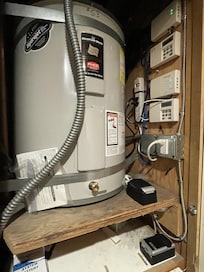 Utility closet in public hallway with water shut off devices