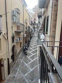 View from balcony one story above hotel entrance.