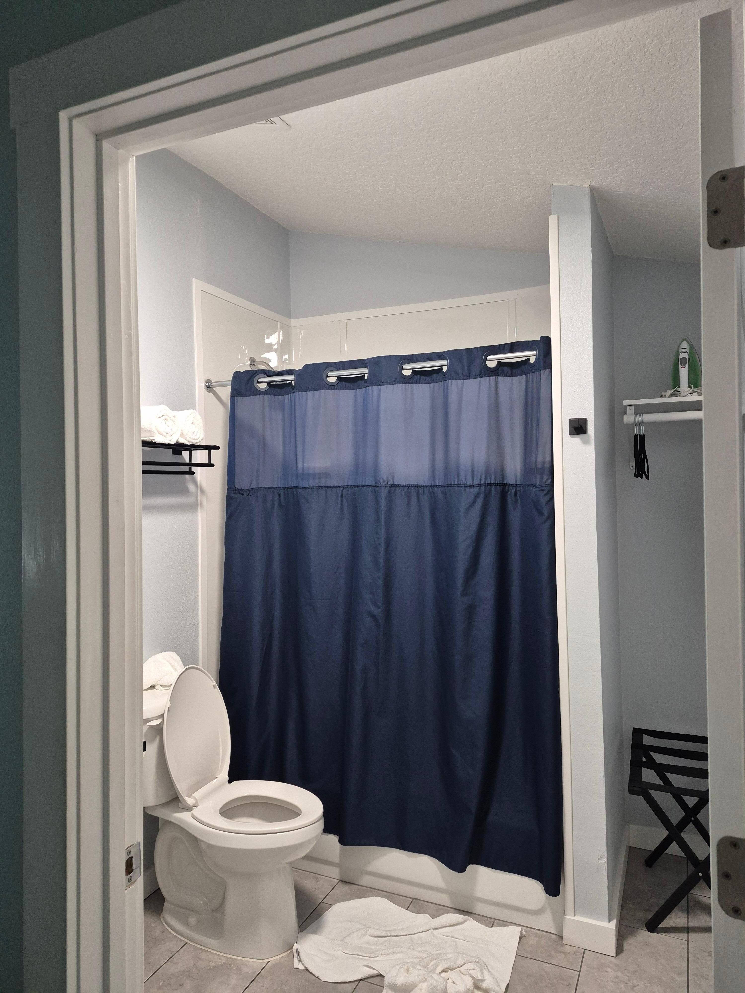The bathroom has a twist shower head for jets or shower spray.