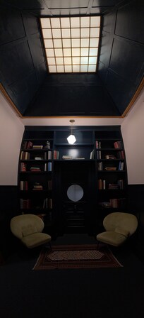 The upstairs reading area right before you go into your room.