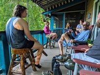 Four generations enjoying the porch and mountains