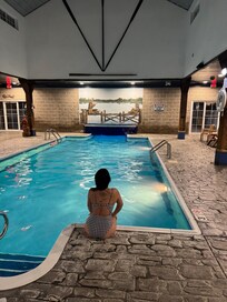 their pool was heated very nice. pool connects to outside pool, you can swim under the rubber curtain goes to outdoor pool. very cool.