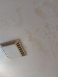 Tar on the ceiling and tape holding the fan cover on